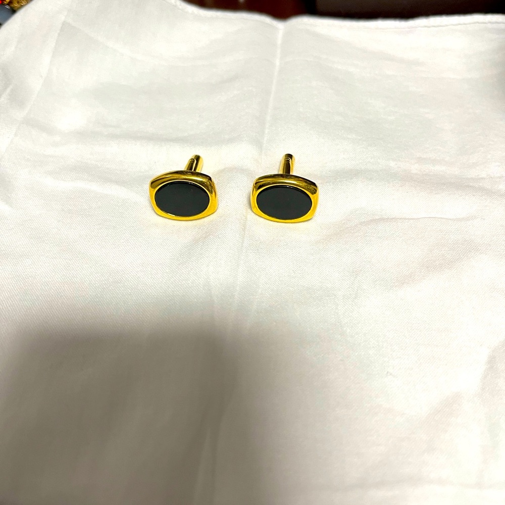 Gold and onyx cuff links